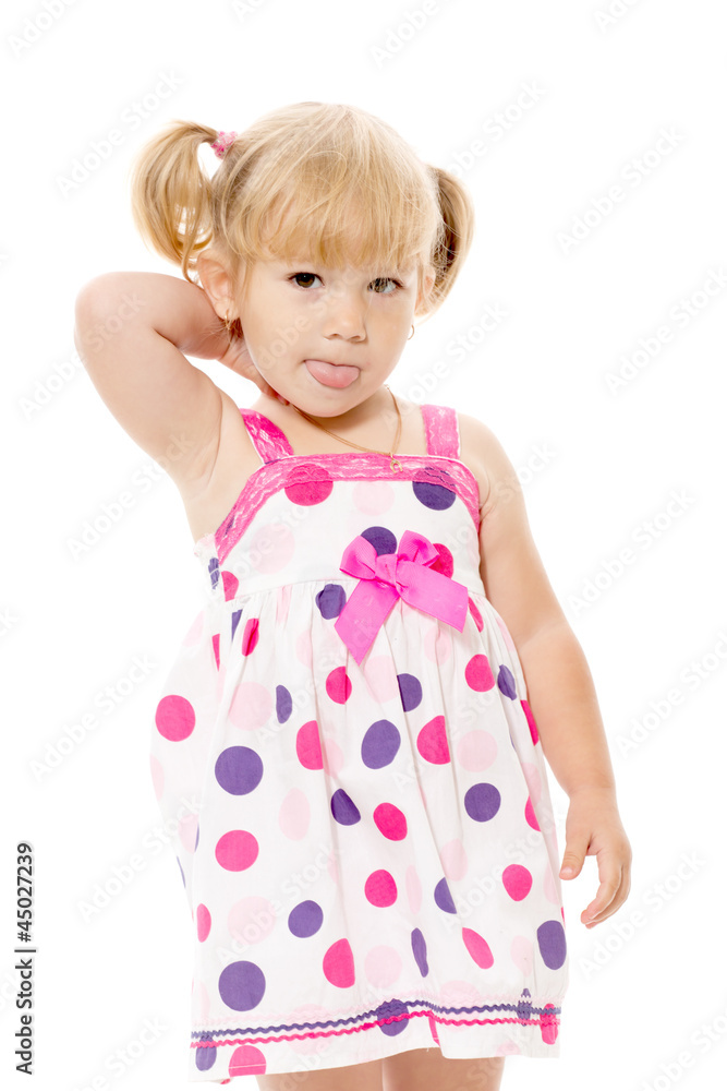The little girl shows tongue The little girl shows tongue
