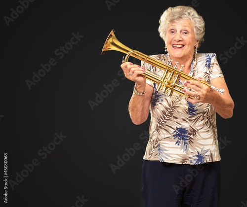 Portrait Of A Senior Woman Holding A Trumpet