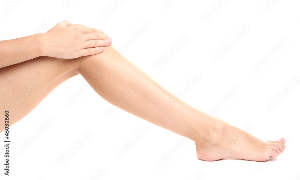 woman holding sore leg, isolated on white