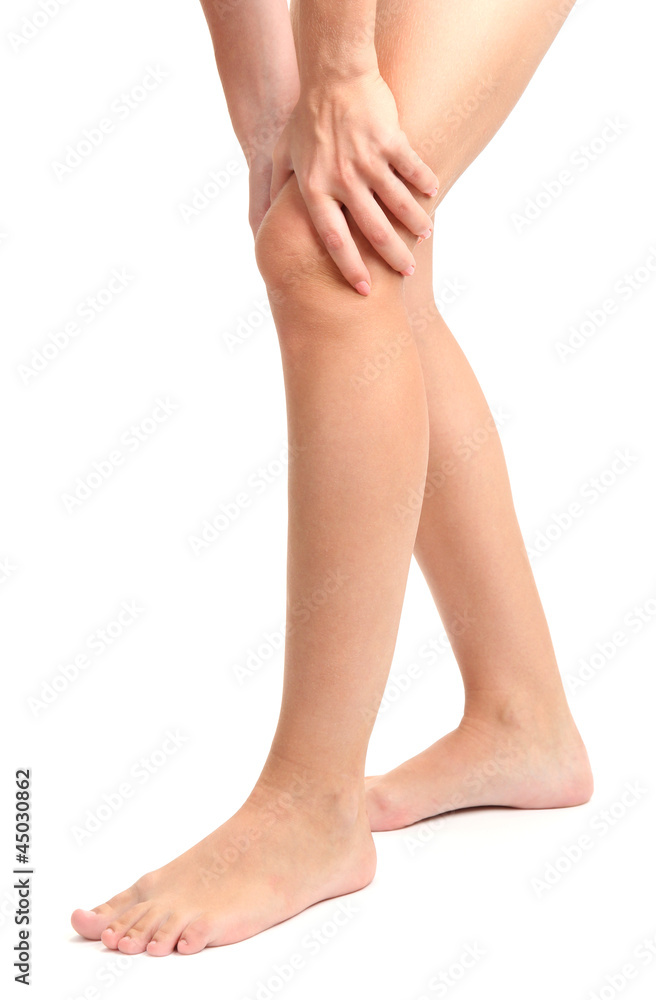 woman holding sore leg, isolated on white woman holding sore leg, isolated on white