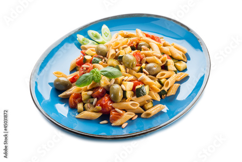 cold pasta salad with pachino olives zucchins and pine kernel