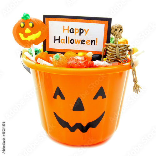 Halloween candy holder full of candy and Happy Halloween tag photo