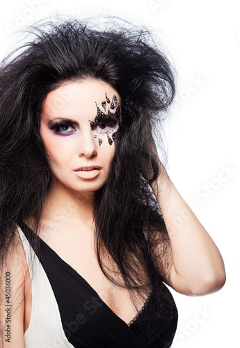 Brunette woman in dress with face art