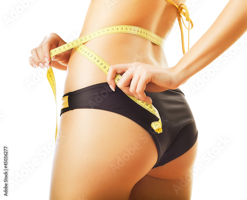 slimming woman in panties with measure