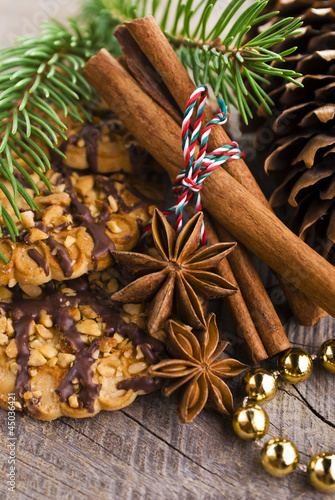 Fototapeta Naklejka Na Ścianę i Meble -  Christmas cakes on brown wooden background (selective focus)