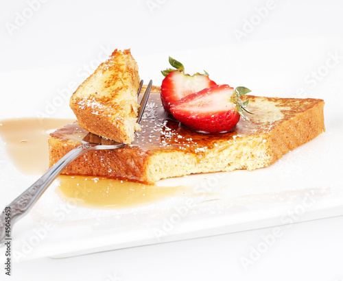 French toast with syrup and strawberry