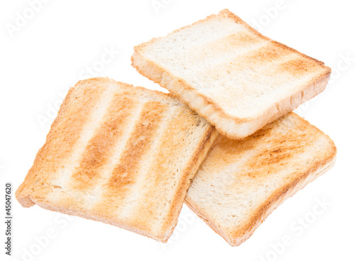 Heap of toasted bread on white