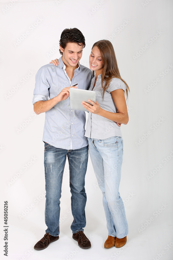 Young couple doing shopping on internet Young couple doing shopping on internet