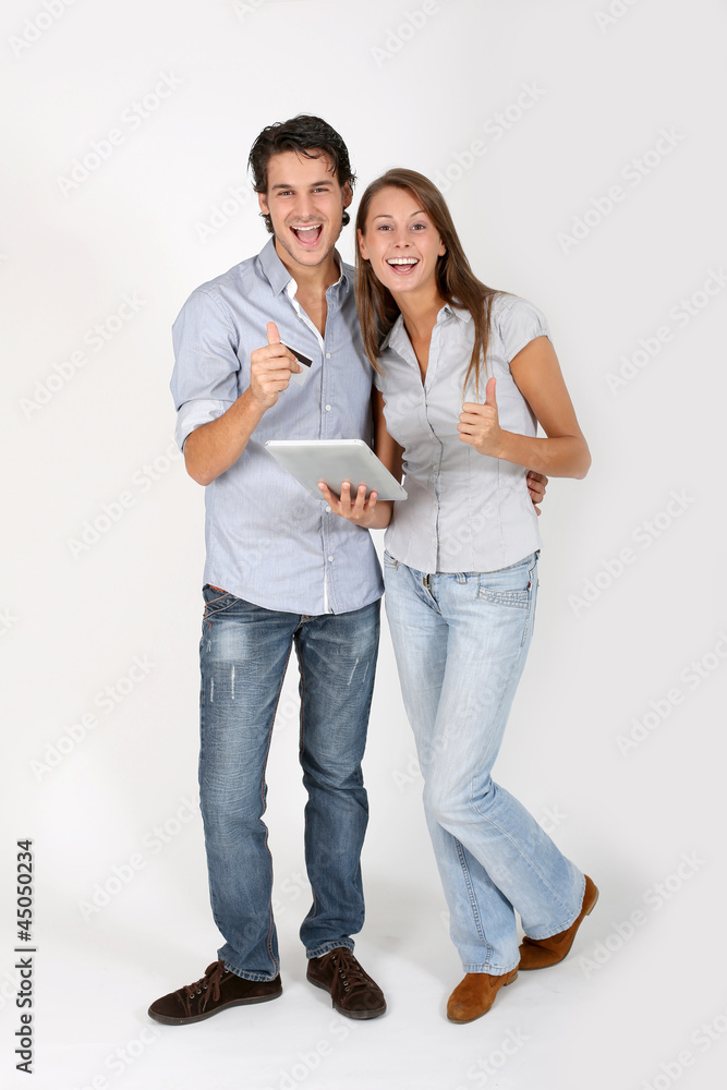 Naklejka premium Young couple doing shopping on internet