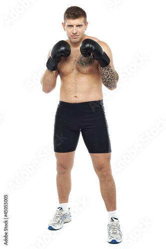 Full length portrait of attractive boxer posing