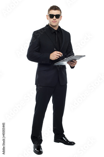 Male bouncer holding clipboard
