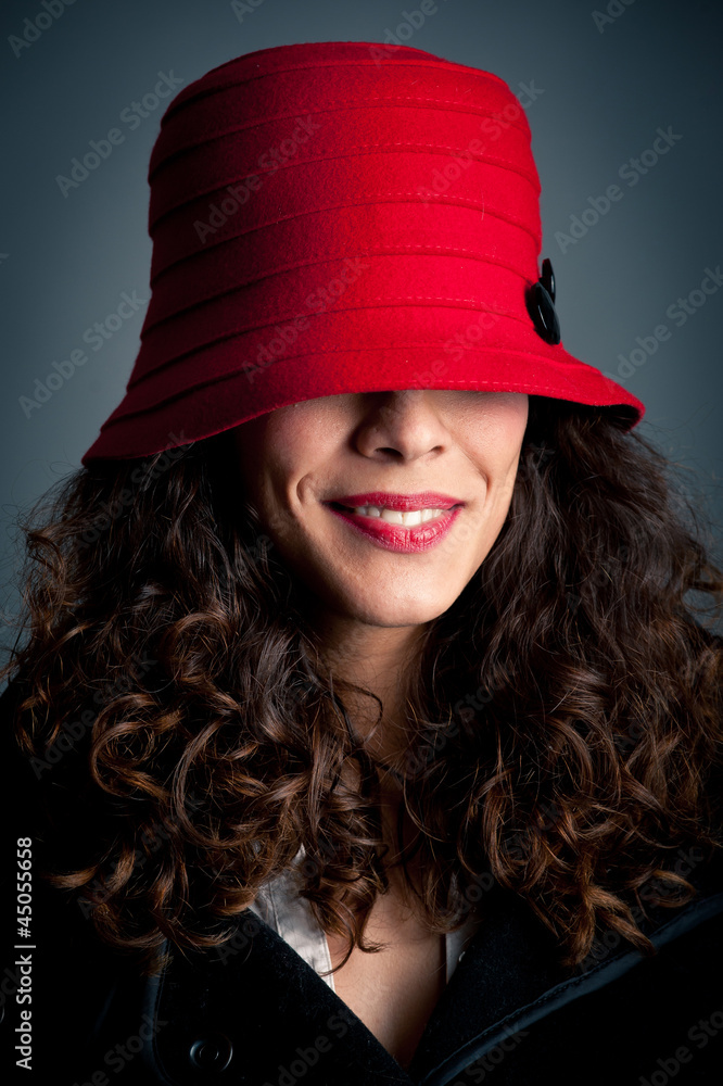 Beautiful woman in red hat against black background. Retro portr Beautiful woman in red hat against black background. Retro portr