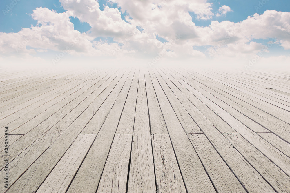Cloudy blue sky and wood floor, background image. Cloudy blue sky and wood floor, background image.
