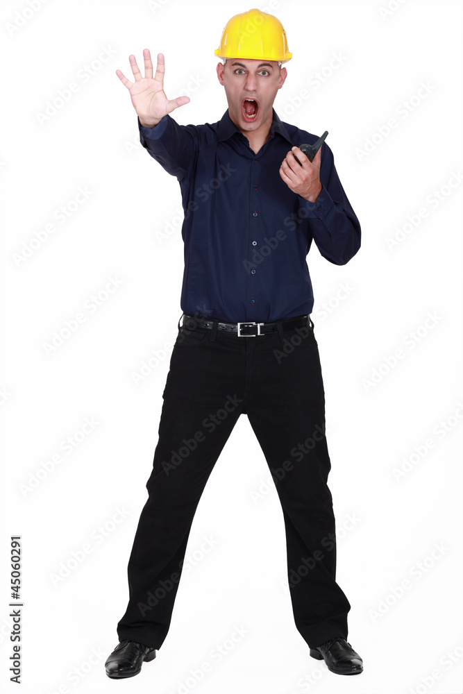 Architect with radio making stop gesture with hand Architect with radio making stop gesture with hand