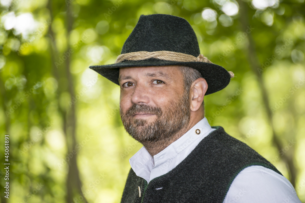 Man with Bavarian traditional black hat iin forest Man with Bavarian traditional black hat iin forest