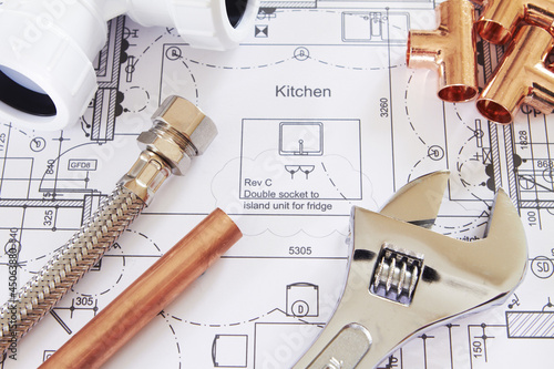 Plumbing Tools Arranged On House Plans