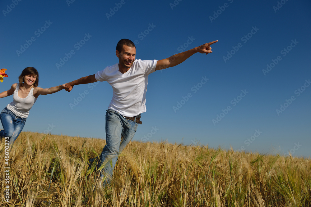 happy couple in wheat field happy couple in wheat field