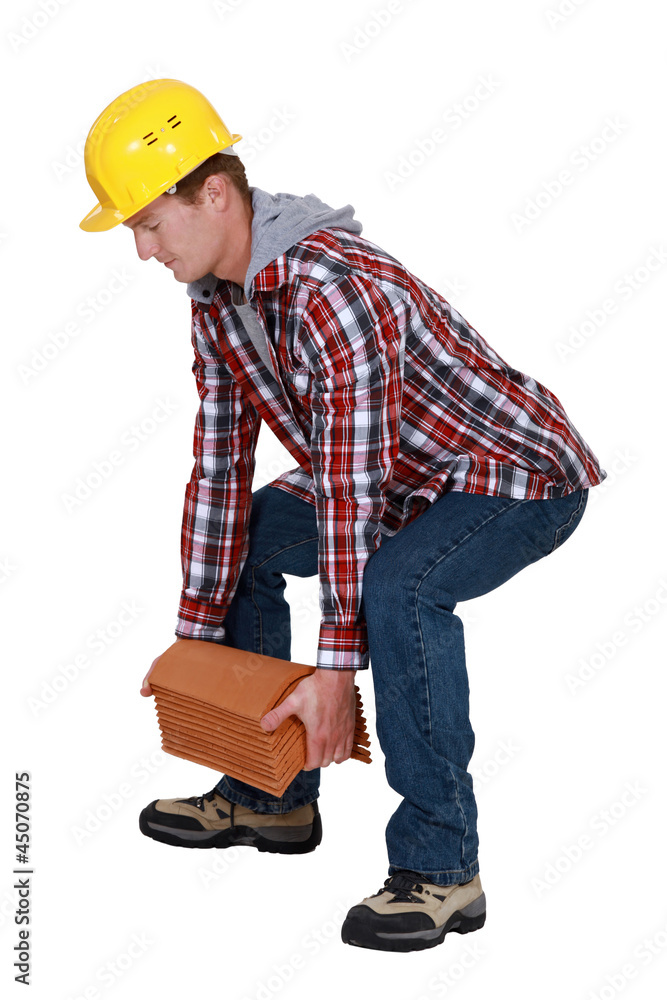 Tradesman lifting shingles Tradesman lifting shingles