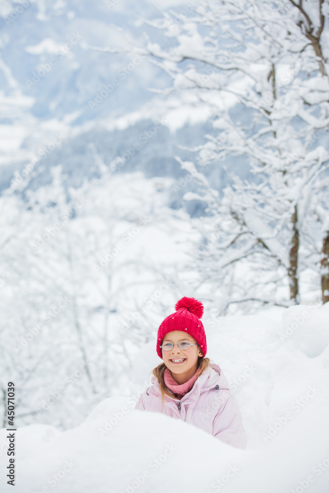 Happy girl having fun on snowing winter day. Happy girl having fun on snowing winter day.