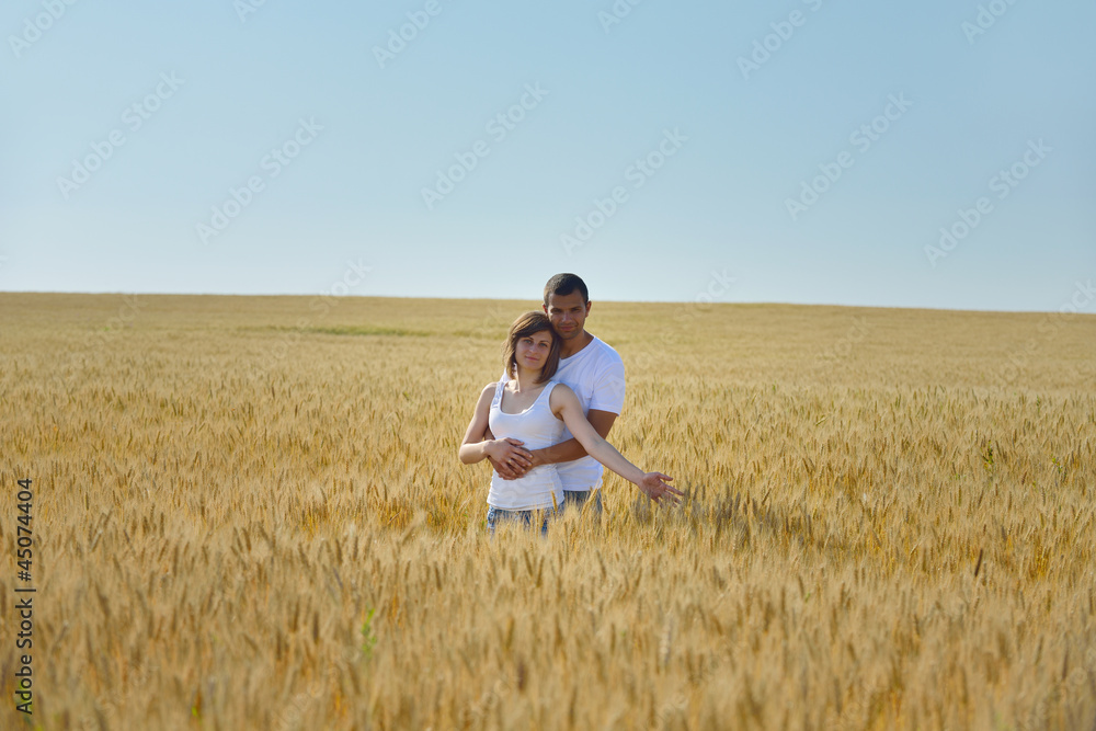 happy couple in wheat field