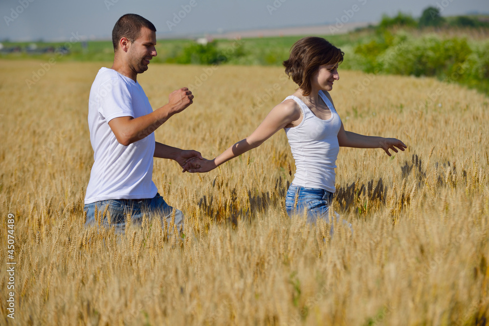 happy couple in wheat field happy couple in wheat field