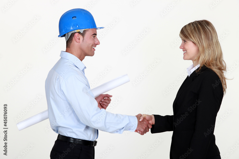 businessman and businesswoman shaking hands businessman and businesswoman shaking hands