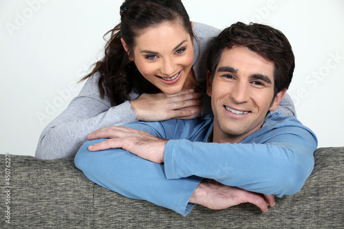 Tableau sur toile Portrait of a loving couple at home