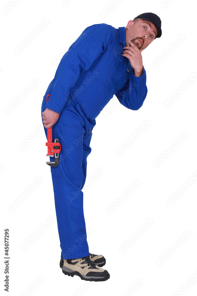 Curious tradesman staring into the distance Curious tradesman staring into the distance