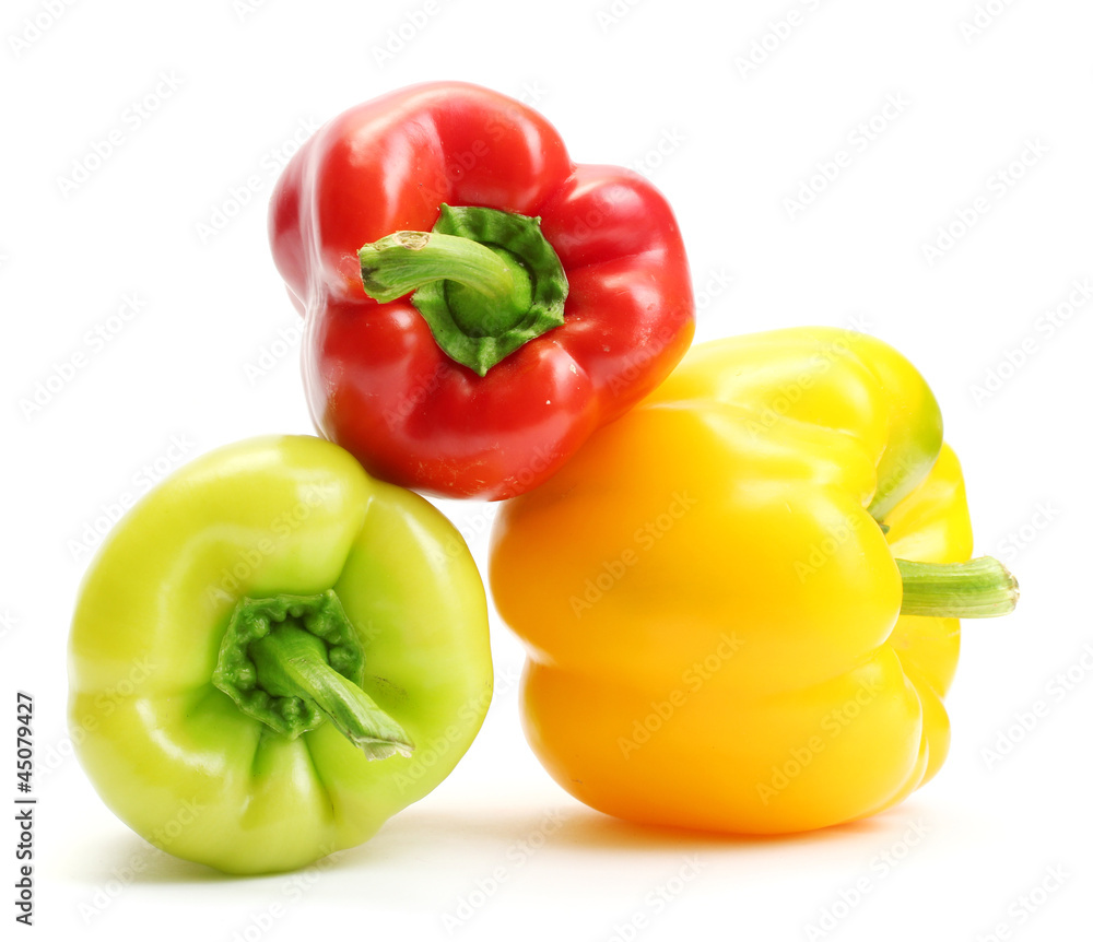 fresh yellow, red and green bell peppers isolated on white fresh yellow, red and green bell peppers isolated on white