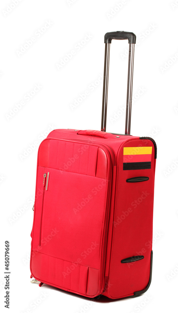 red suitcase with sticker with flag of Germany isolated on red suitcase with sticker with flag of Germany isolated on