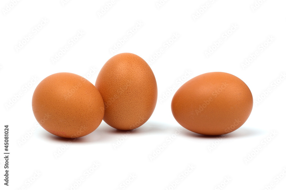 Three eggs closeup isolated on white background. Three eggs closeup isolated on white background.