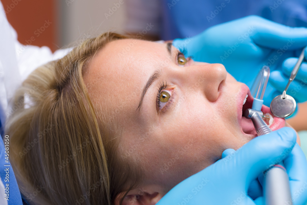Close-up of dental tools patient open mouth Close-up of dental tools patient open mouth