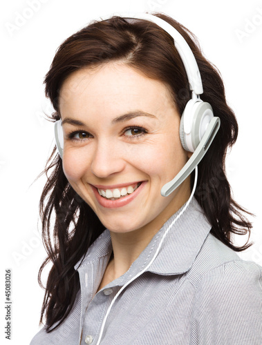 Lovely young woman is talking to customers