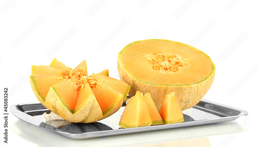 Cut melon on metal tray isolated on white Cut melon on metal tray isolated on white