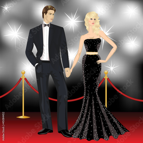 fashion woman and elegant man in front of the paparazzi on the r