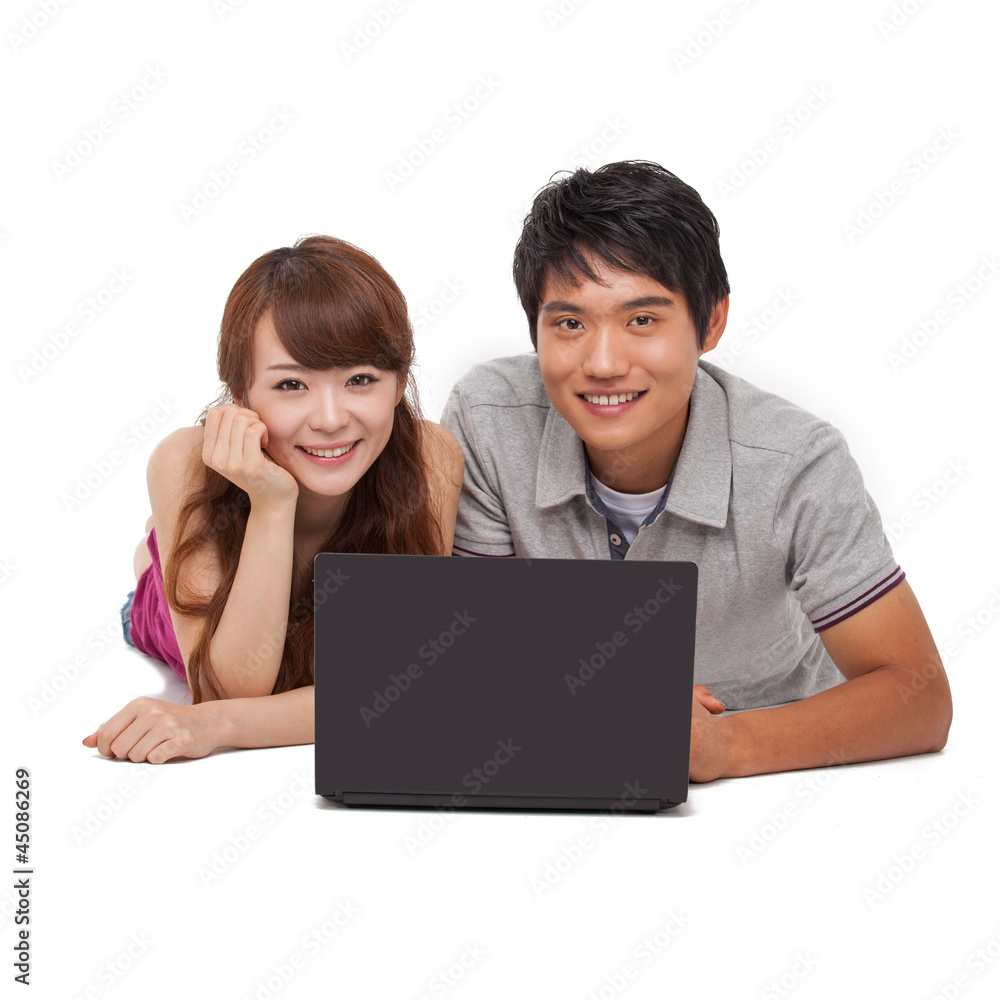 Happy couple using laptop isolated on white background. Happy couple using laptop isolated on white background.