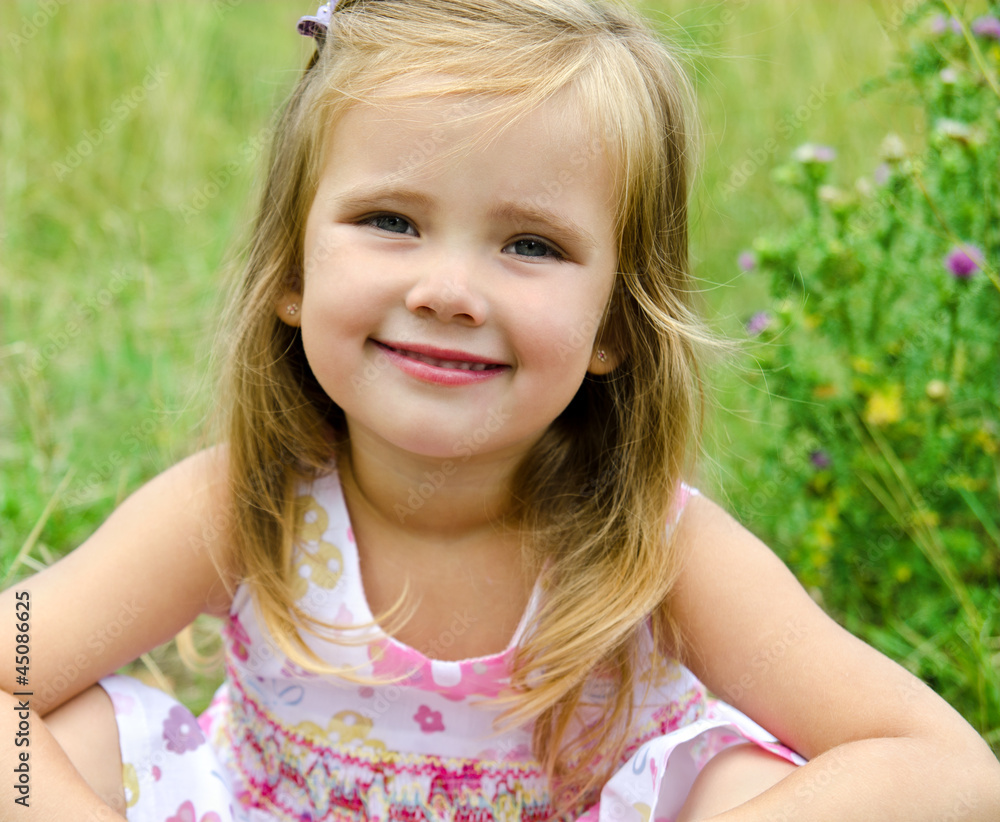 Cute little girl on the meadow