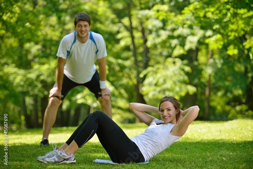 Couple doing stretching exercise after jogging