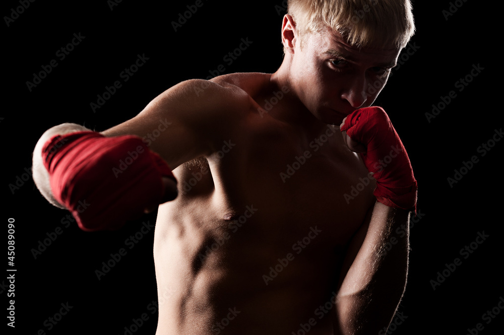 professional boxer over dark background professional boxer over dark background