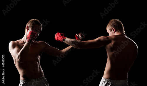 fighters boxing in the dark