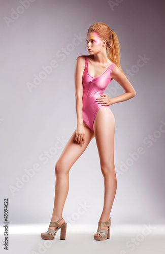 Sexy blonde with long legs isolated over white background