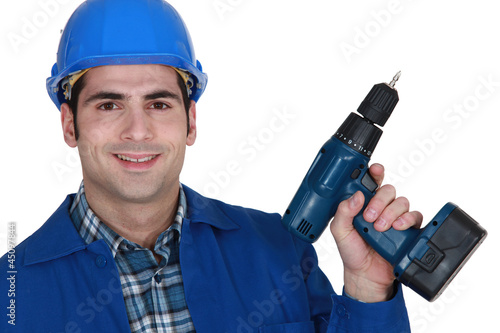craftsman holding a drill