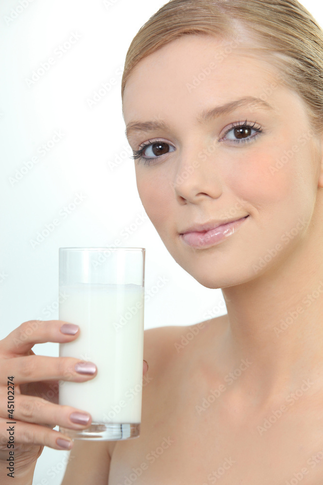 Woman holding glass of fresh milk Woman holding glass of fresh milk