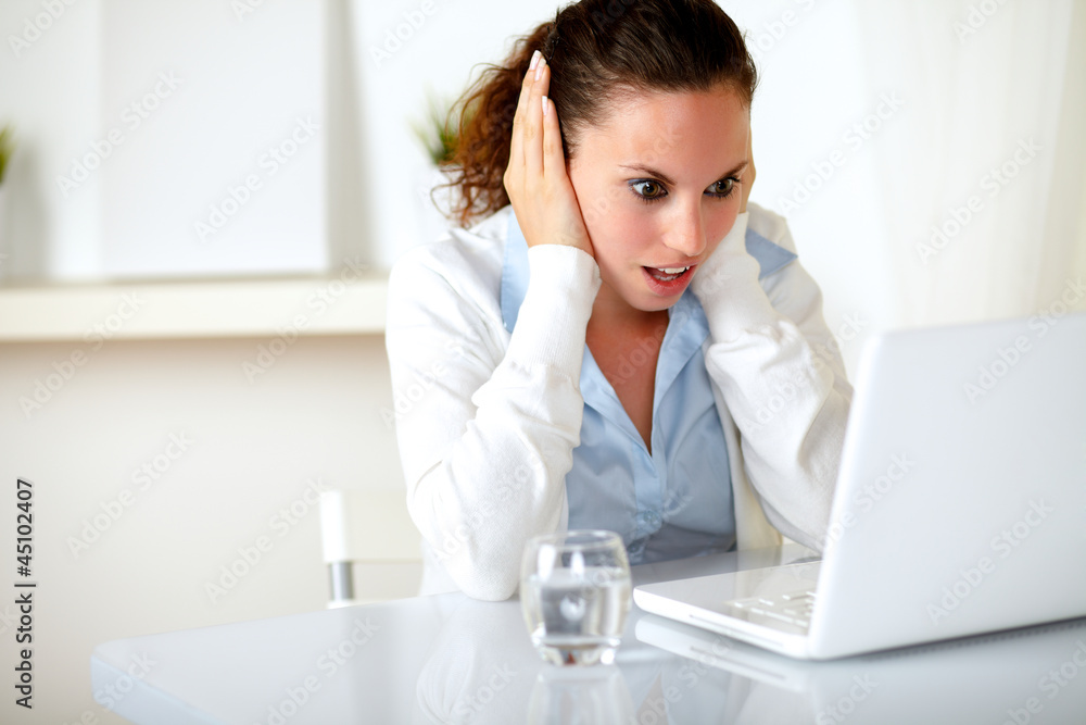 Surprised and stressed young woman reading Surprised and stressed young woman reading