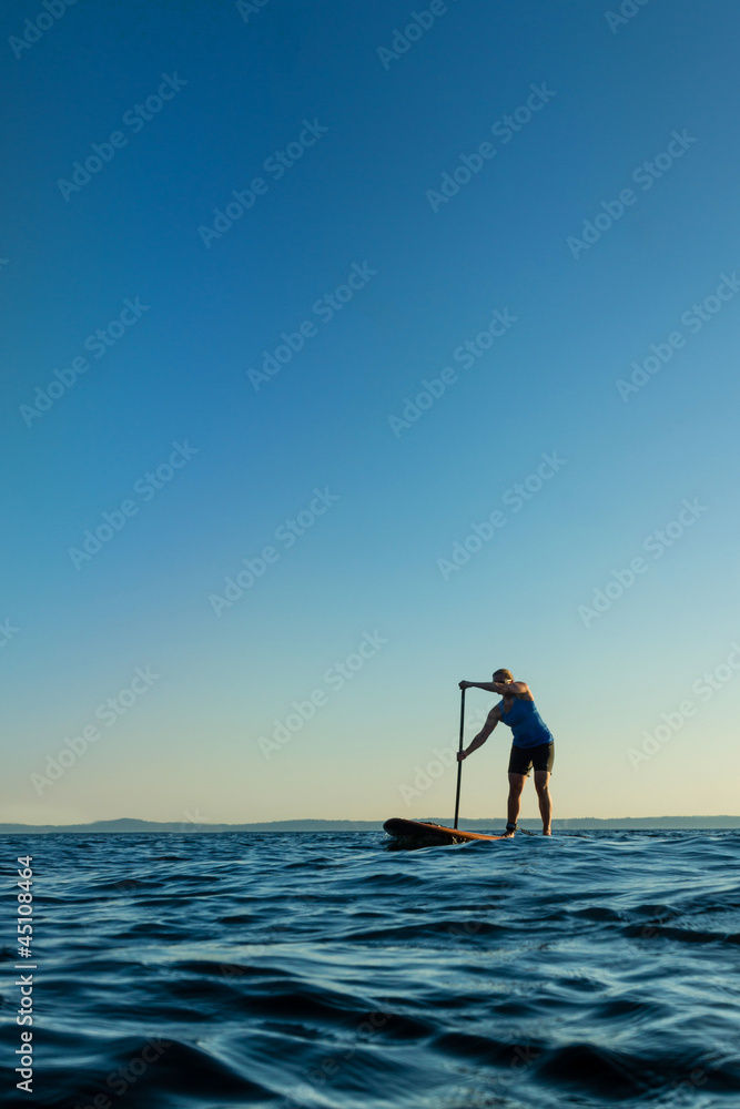 Woman on Stand Up Paddle Board at Sunset