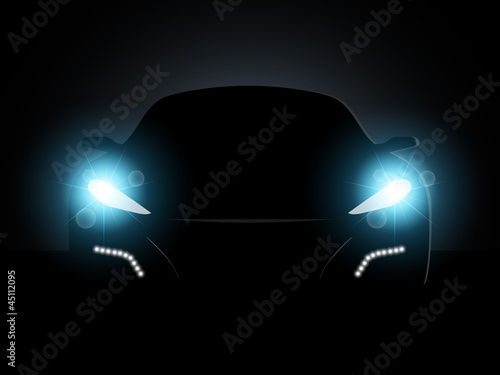 The car in the dark with the included headlights.