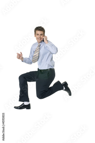 Smile businessman Using CellPhone jumping