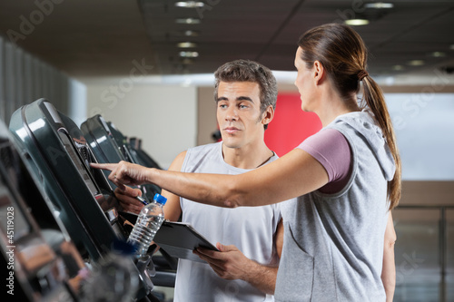 Woman Asking About Machines In Gym