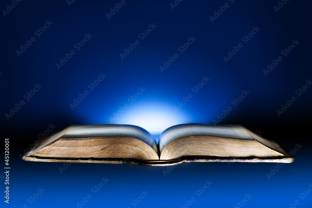 Old book, mystical blue light background | Uwalls.co.uk