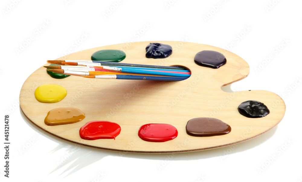 wooden art palette with paint and brushes.isolated on white wooden art palette with paint and brushes.isolated on white